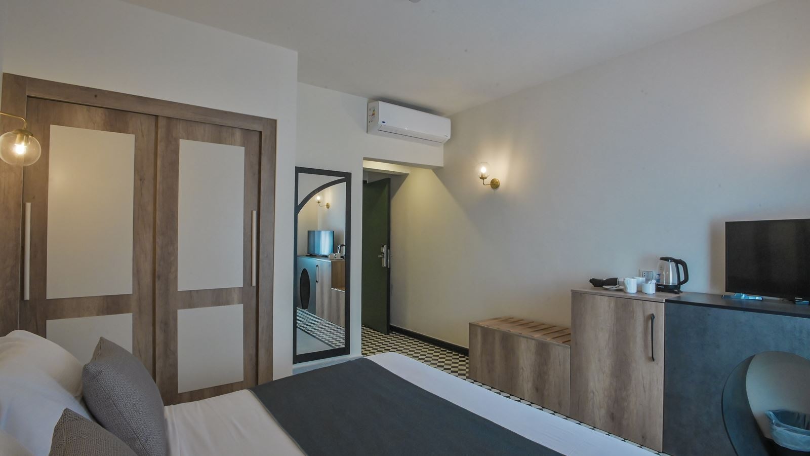 rooms-standard-room-back-view-bedroom-with-queen-size-bed-bathroom-with-shower-window