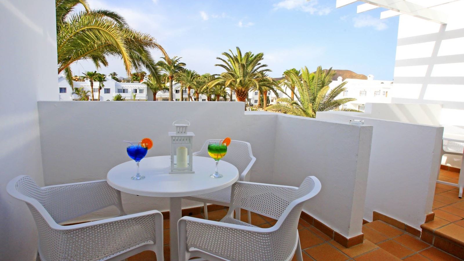 rooms-deluxe-room-pool-view-balcony-or-terrace