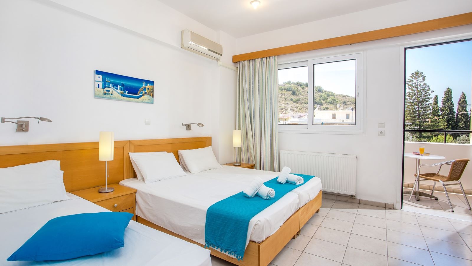 rooms-triple-room-garden-view-with-balcony