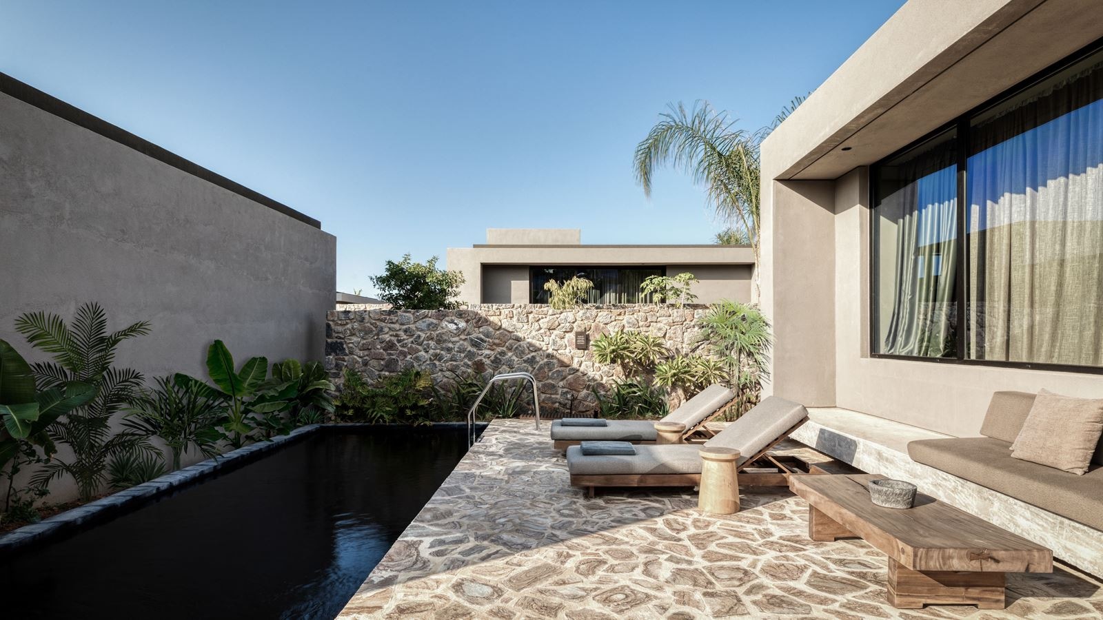 rooms-tropical-family-room-shared-pool