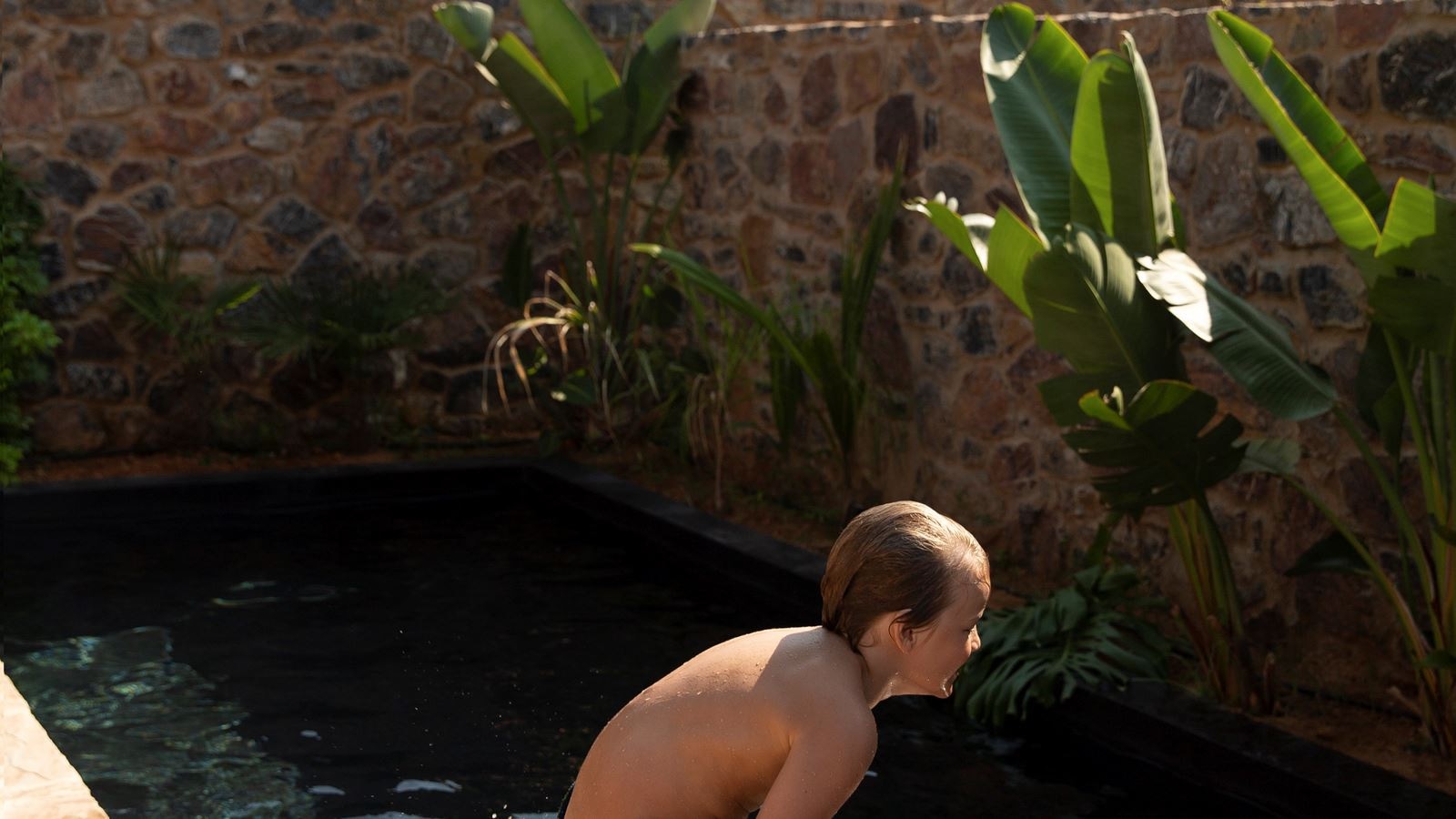 rooms-tropical-family-room-shared-pool