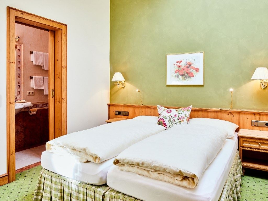 rooms-wellness-garden-suite-with-balcony-or-terrace-70-square-meters